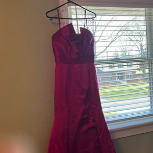 Theia Couture beautiful magenta gown with embellishment around the chest.